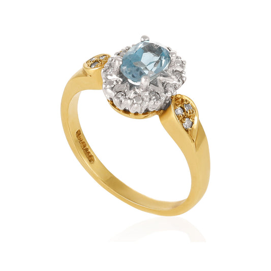 9ct yellow gold ring with diamonds and a blue gemstone